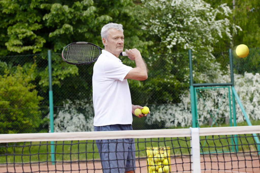 portrait of active tennis trainer serving tennis b 2026 01 09 14 43 37 utc